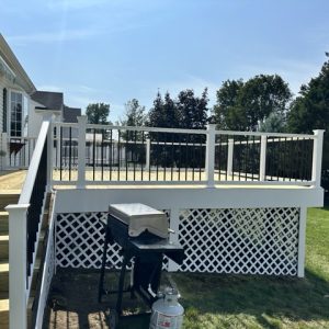 Raised deck with white and black railing 1