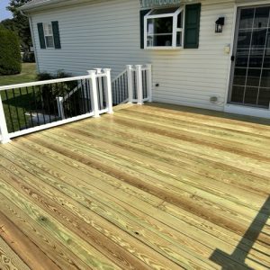 Raised deck with white and black railing 6