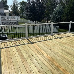 Raised deck with white and black railing 8